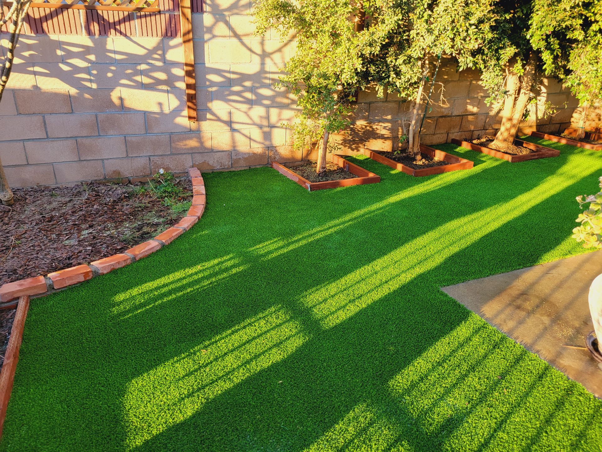 artificial grass around planters
