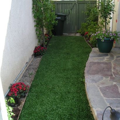 artificial grass next to stone pathway