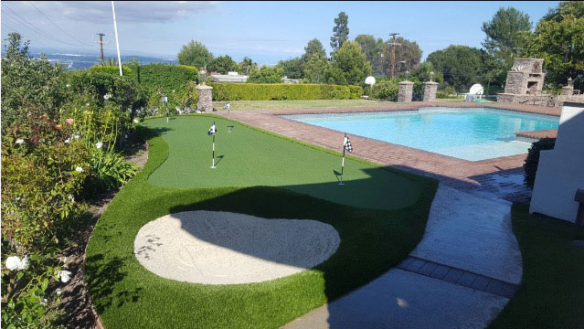 artificial putting green near pool