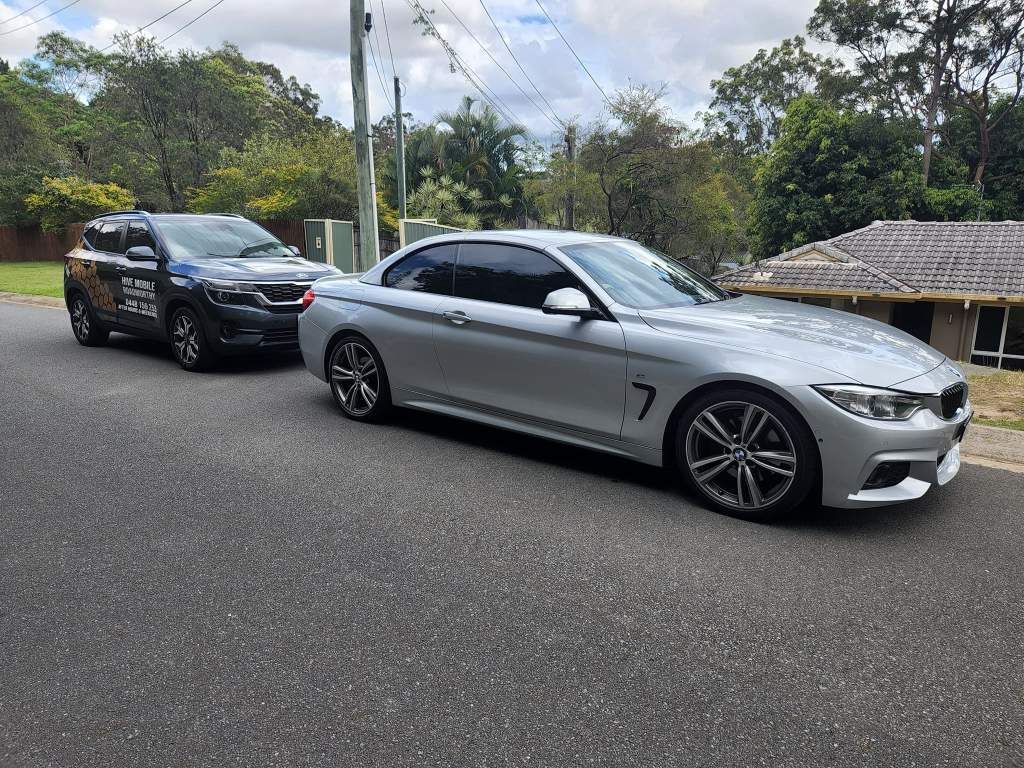 Two Cars Are Parked Next to Each Other on the Side of the Road — Hive Mobile Roadworthy in Mount Nathan, QLD
