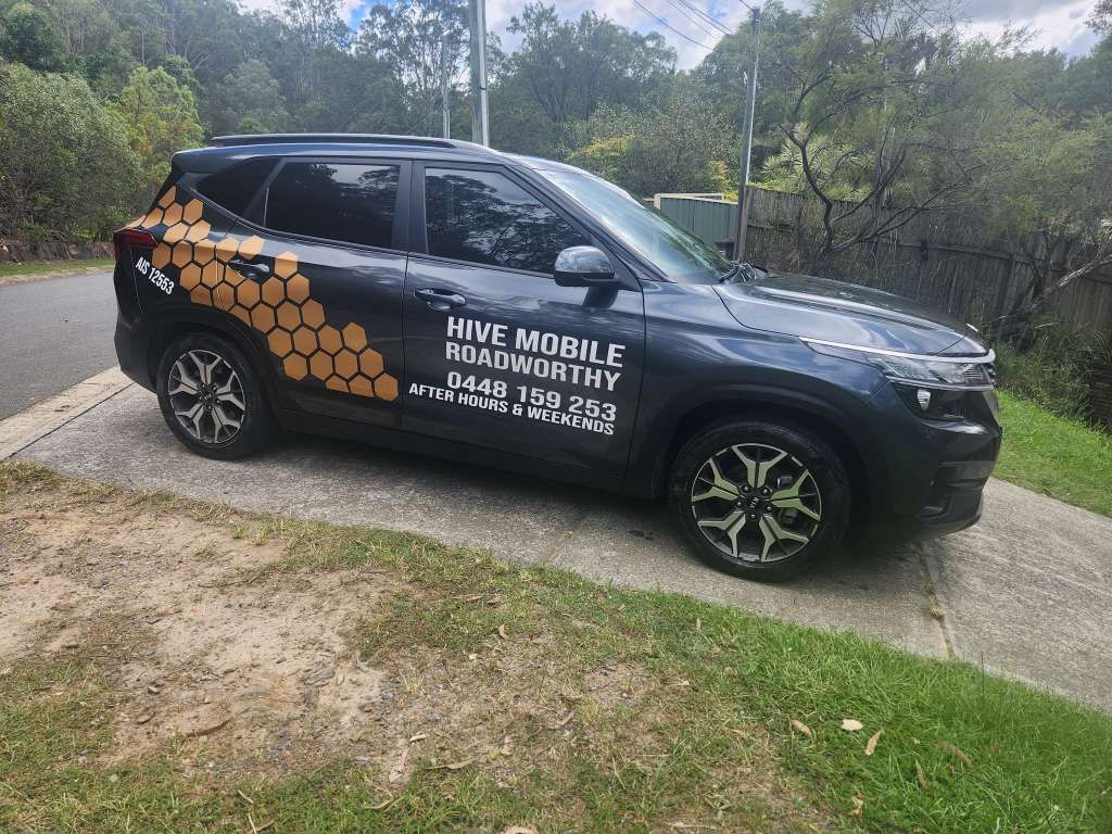 A Black Car is Parked on the Side of the Road — Hive Mobile Roadworthy in Helensvale, QLD