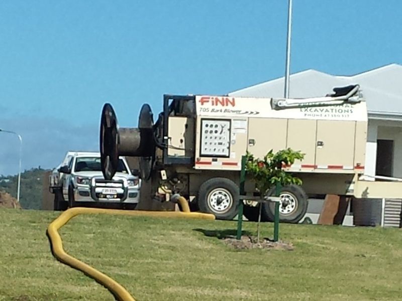 A finn truck with a hose attached to it