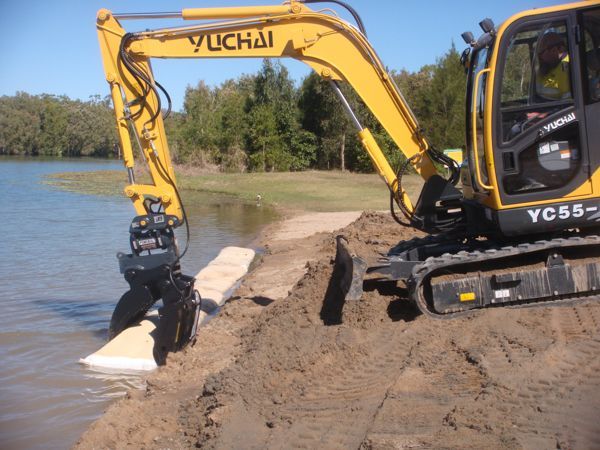 A yellow excavator with the word yuchai on it