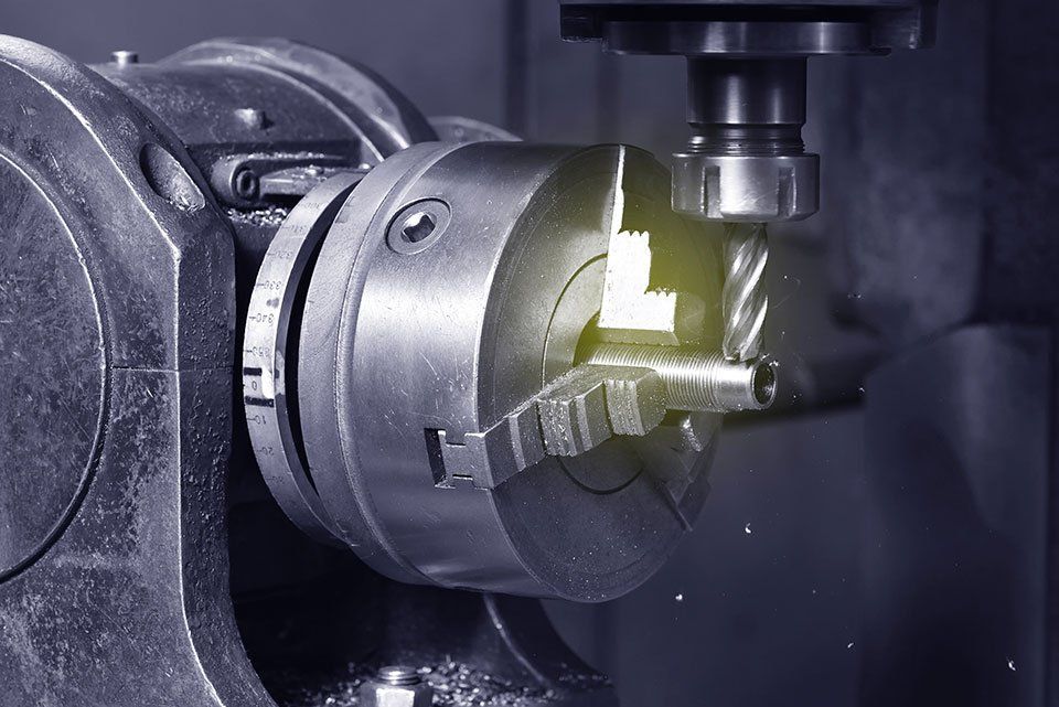 machine drilling a hole in a metal object