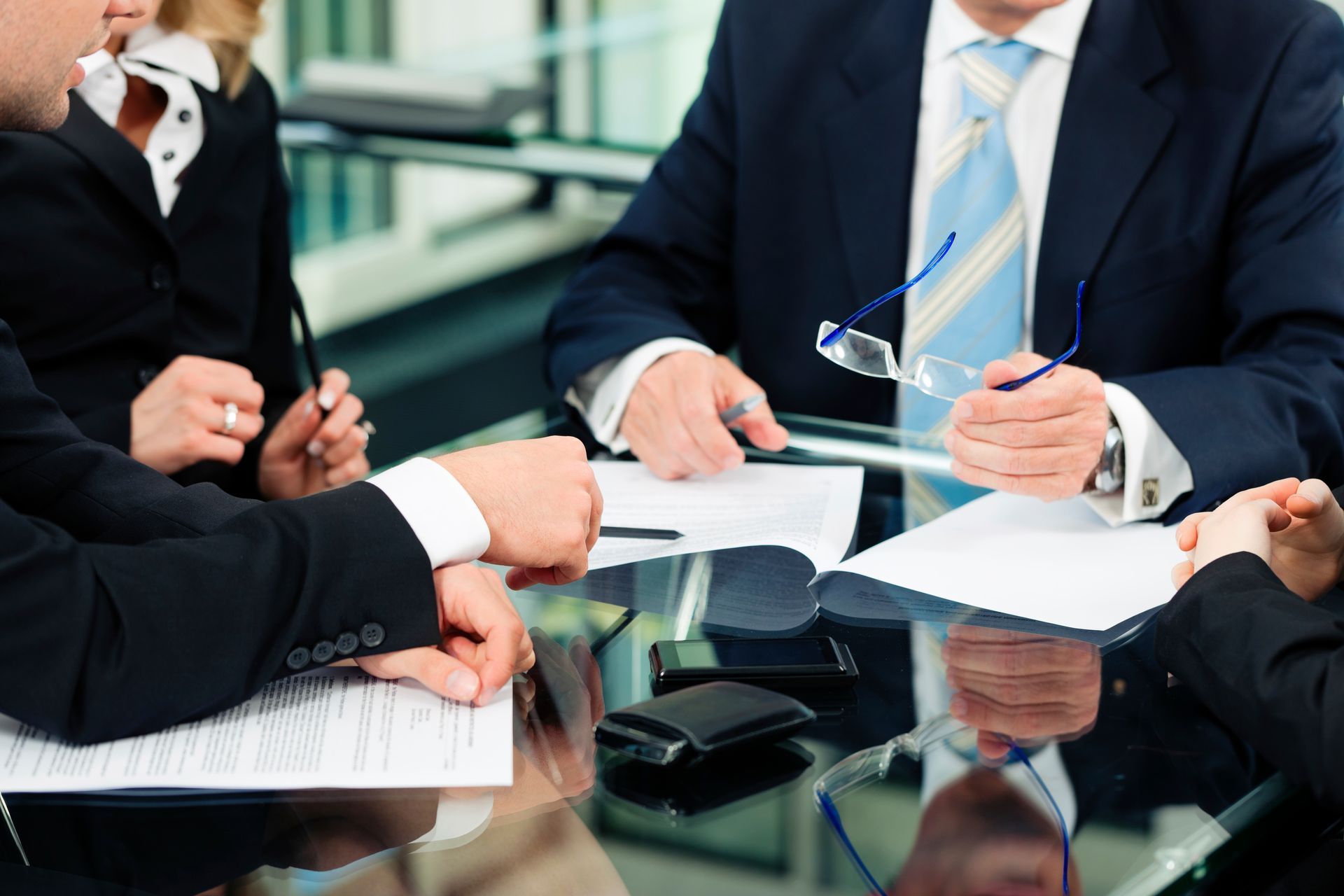 Lawyer consulting with clients at Higinbotham & Higinbotham, PLLC | Morgantown, WV