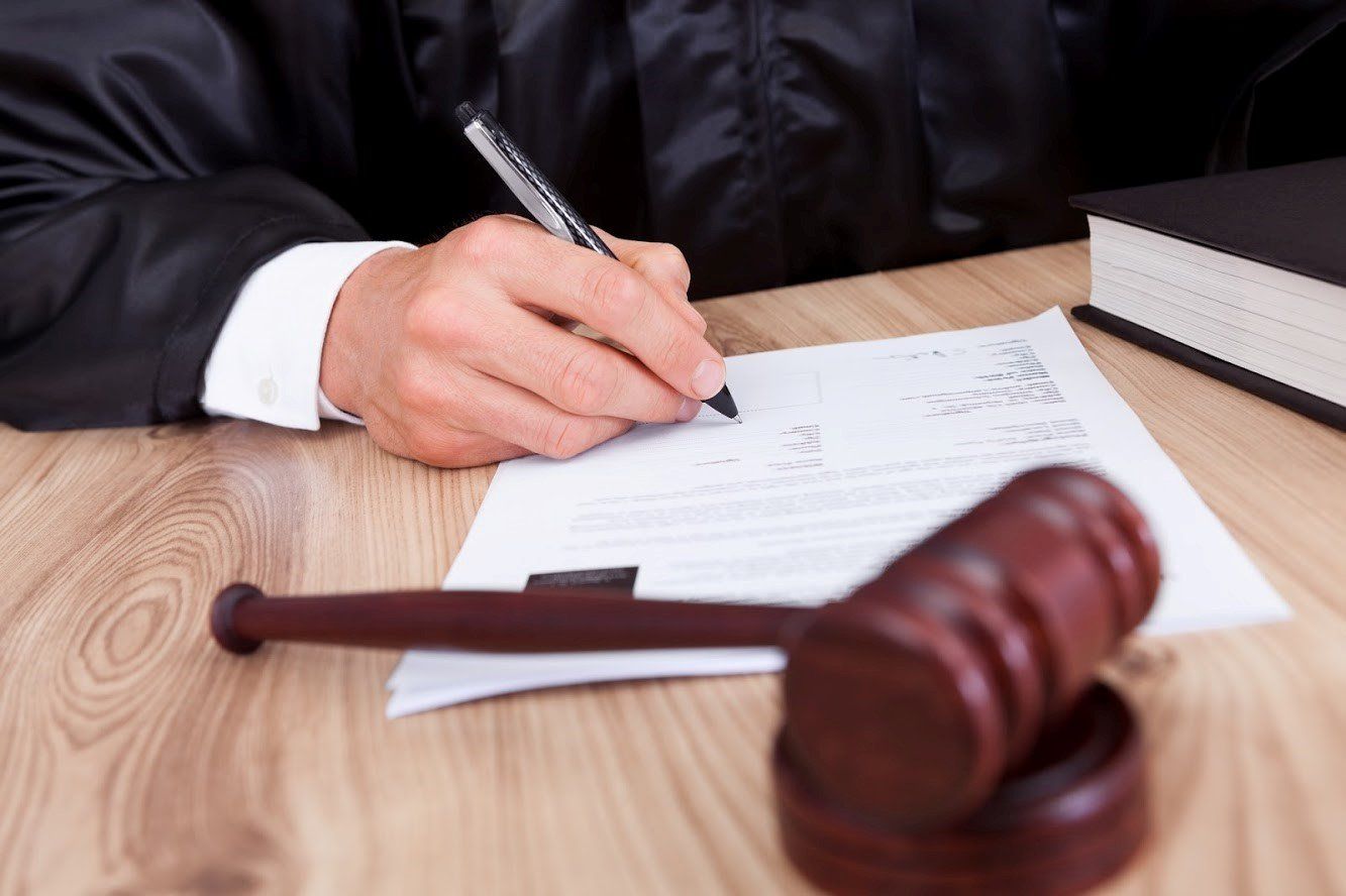 Judge Signing Contract — Fairmont, WV — Higinbotham & Higinbotham LLC