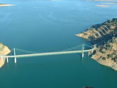 An aerial view of a bridge over a large body of water.