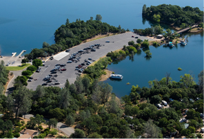 An aerial view of a lake with a small island in the middle