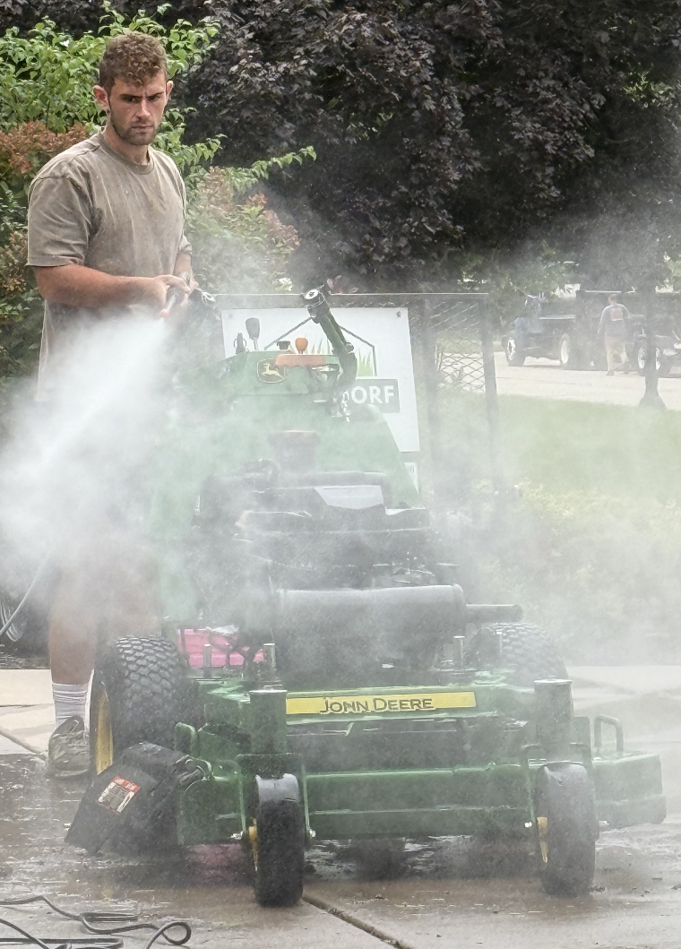 Professional lawn mowing service in the Quad Cities area, covering Moline, Davenport, Bettendorf, and Rock Island