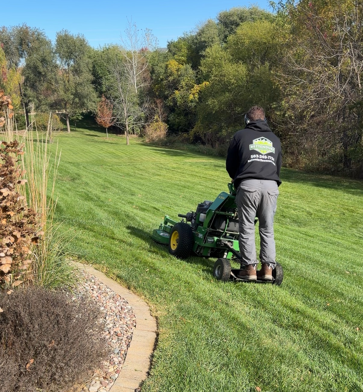 Professional lawn mowing service in the Quad Cities area, covering Moline, Davenport, Bettendorf, and Rock Island