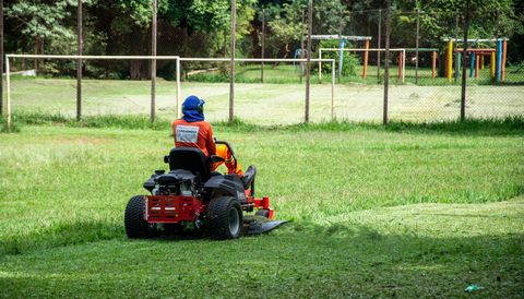 Professional lawn mowing service in the Quad Cities area, covering Moline, Davenport, Bettendorf, and Rock Island