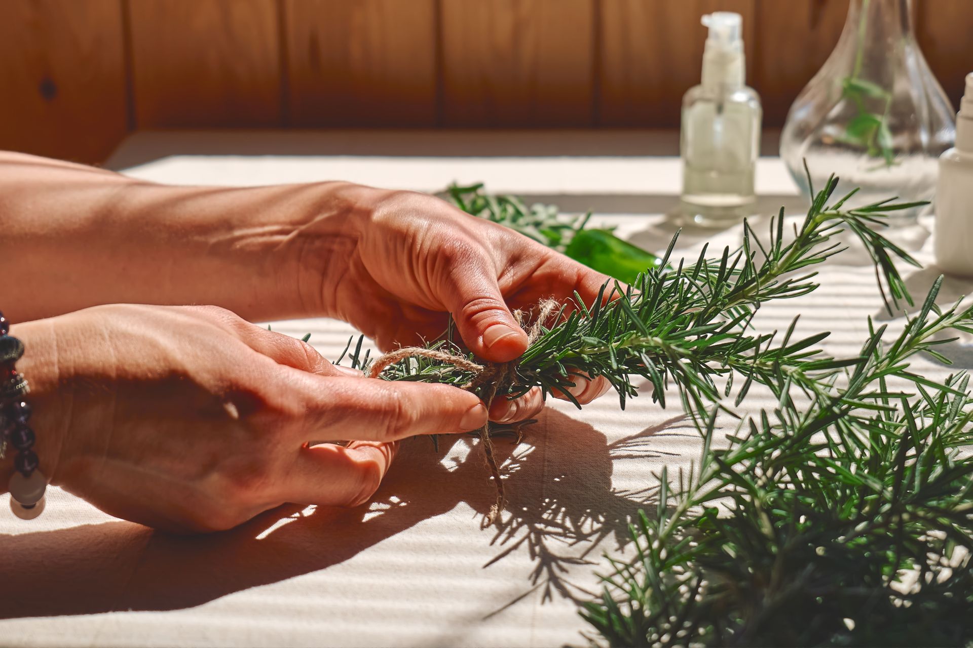 a woman holding herbs in her hand