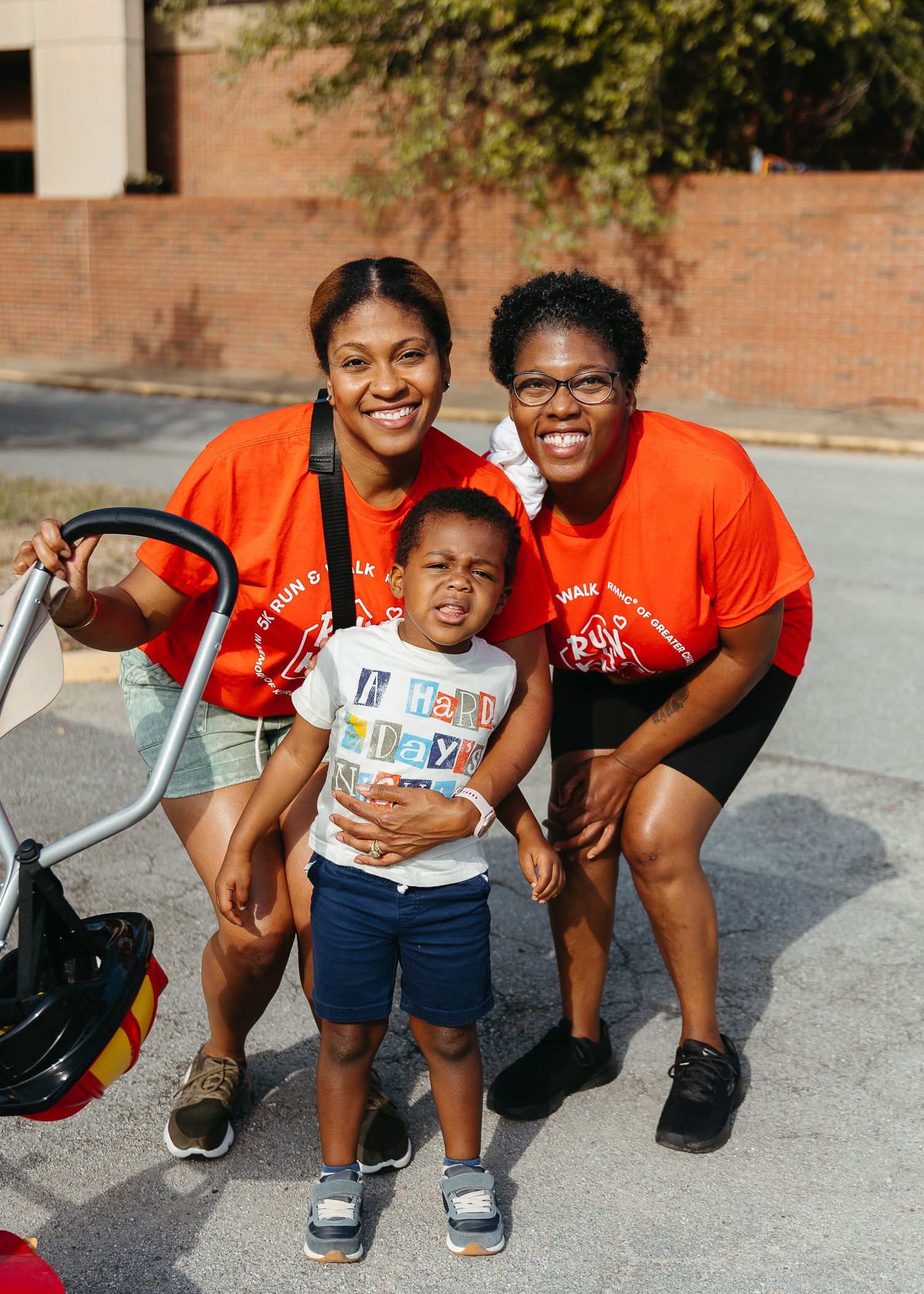 Two women and a child are posing for a picture.