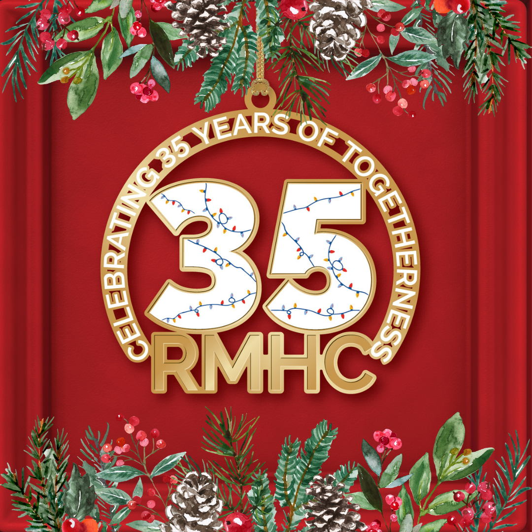 A christmas ornament with a christmas tree in the middle of a wreath.