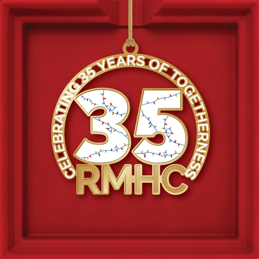 A christmas ornament with a peace sign and a christmas tree on it.