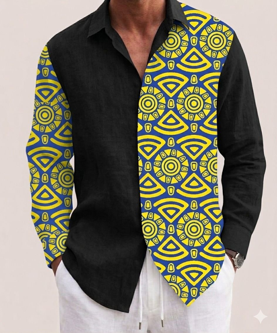 Una camisa negra de manga larga con un panel estampado en azul brillante y amarillo en el lateral izquierdo y en la manga izquierda.