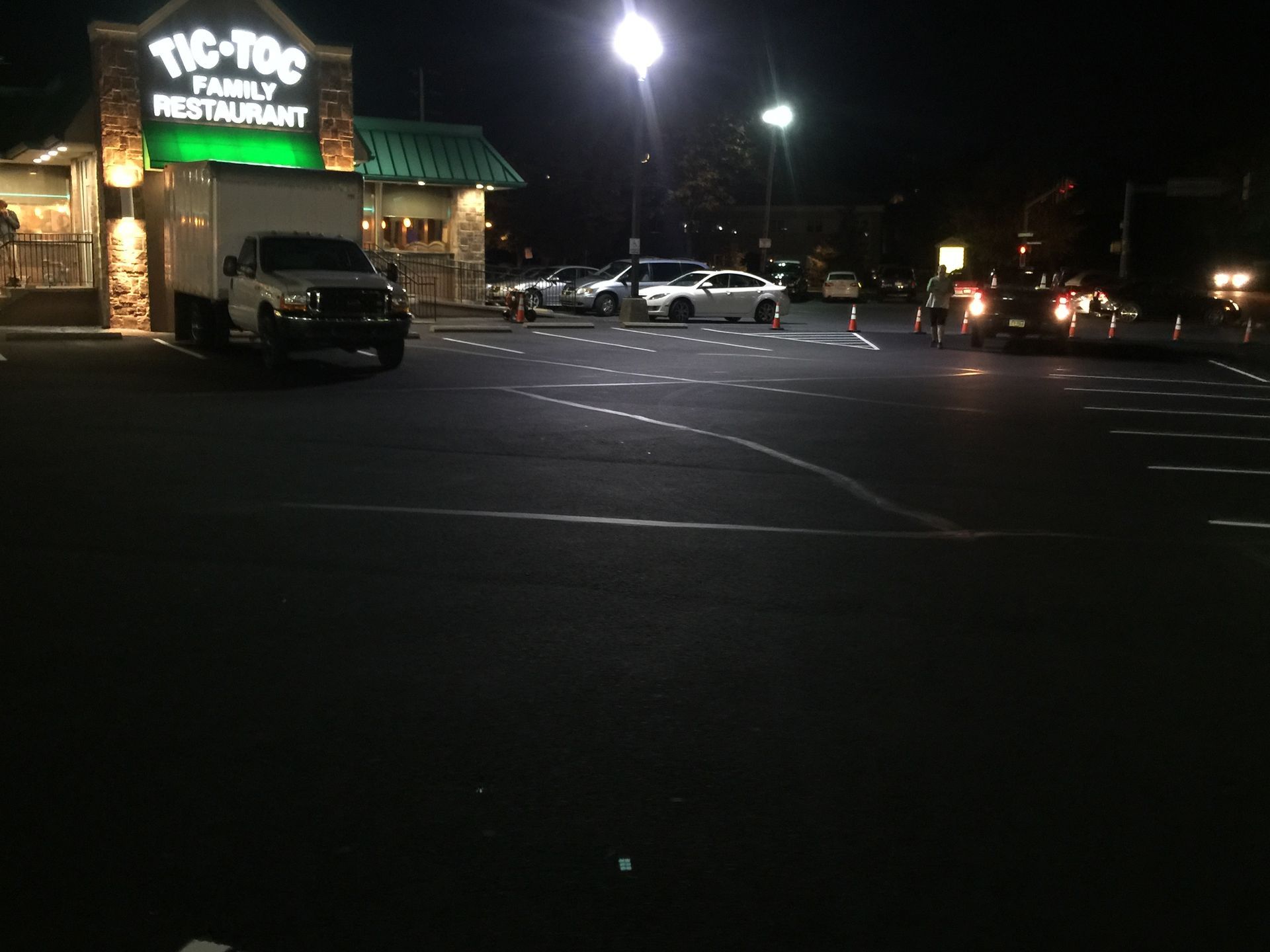 A tic-toc family restaurant is lit up at night