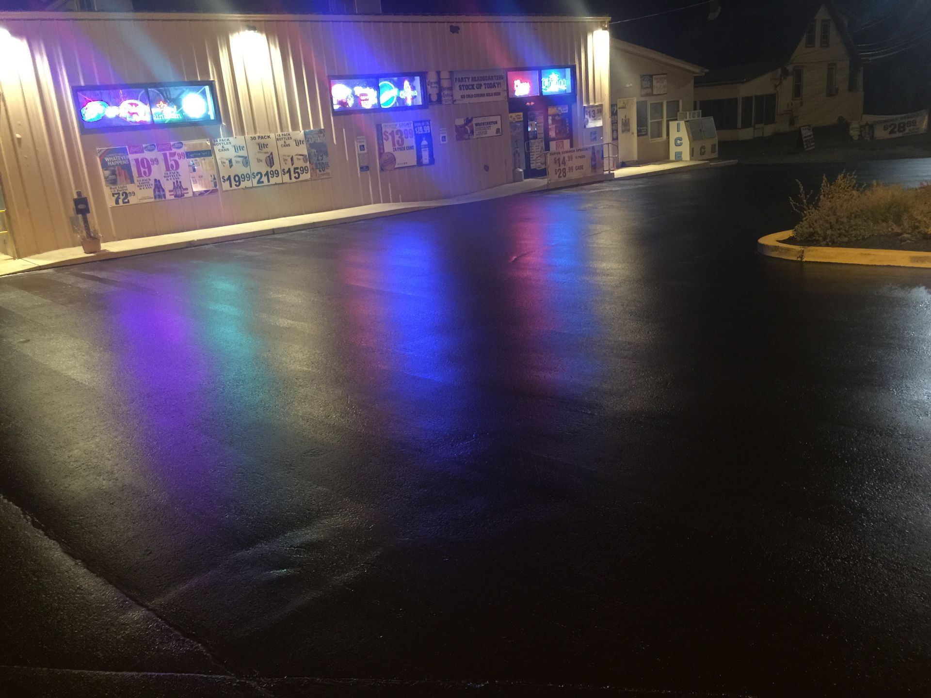 A building with a lot of lights on it is lit up at night.