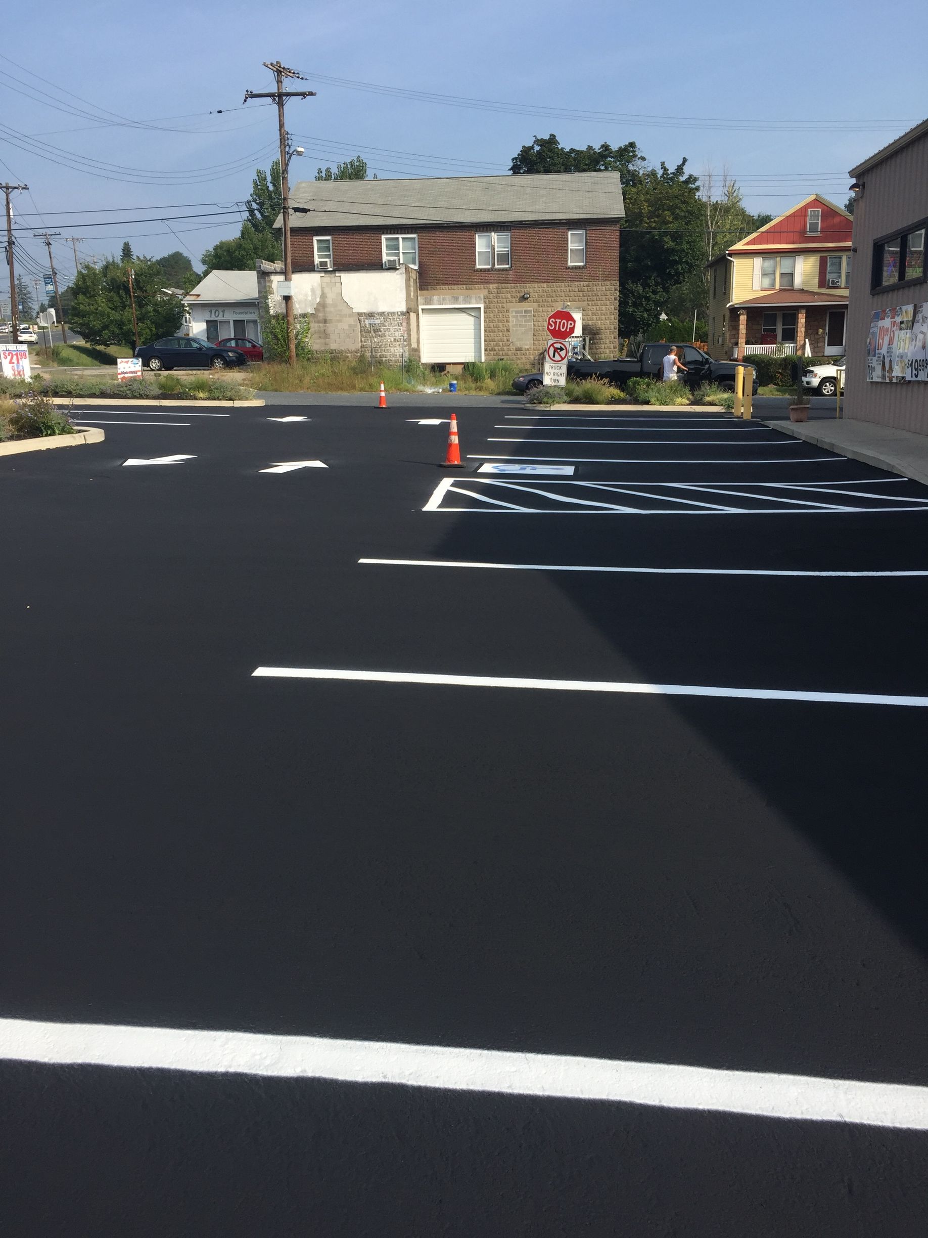 A parking lot with a stop sign in the background