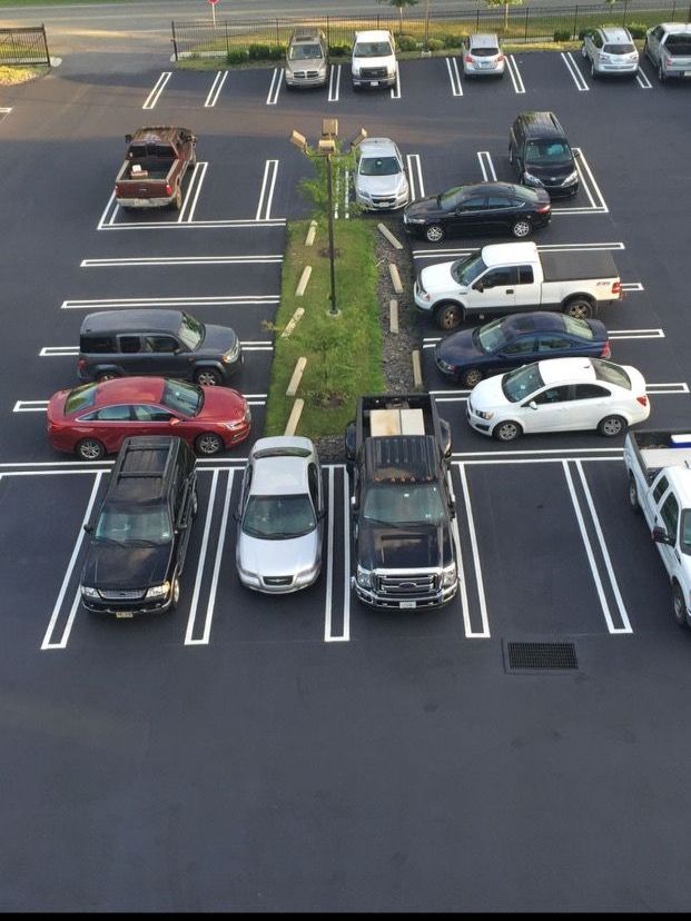 A lot of cars are parked in a parking lot