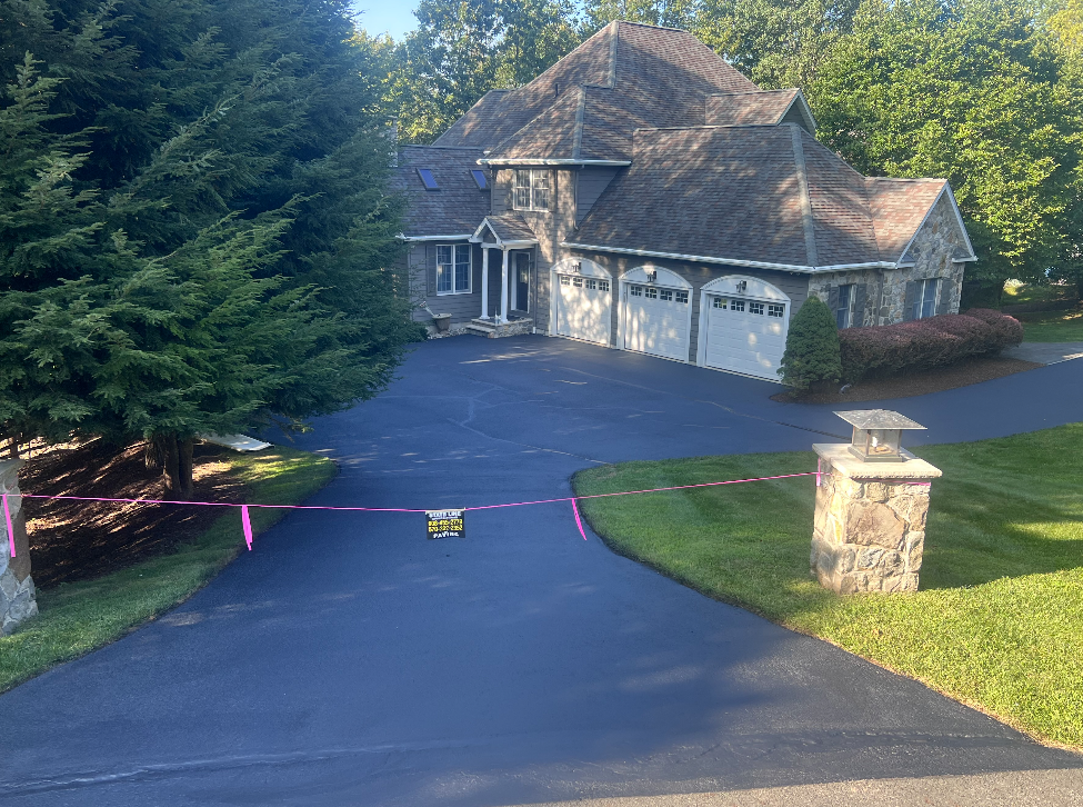 A large house with a driveway leading to it