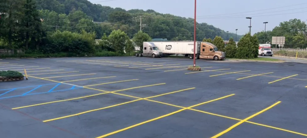 A parking lot with a truck parked in the middle of it.