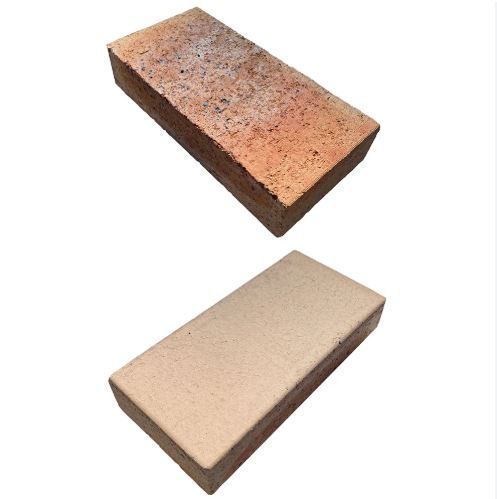 Two bricks are stacked on top of each other on a white background.