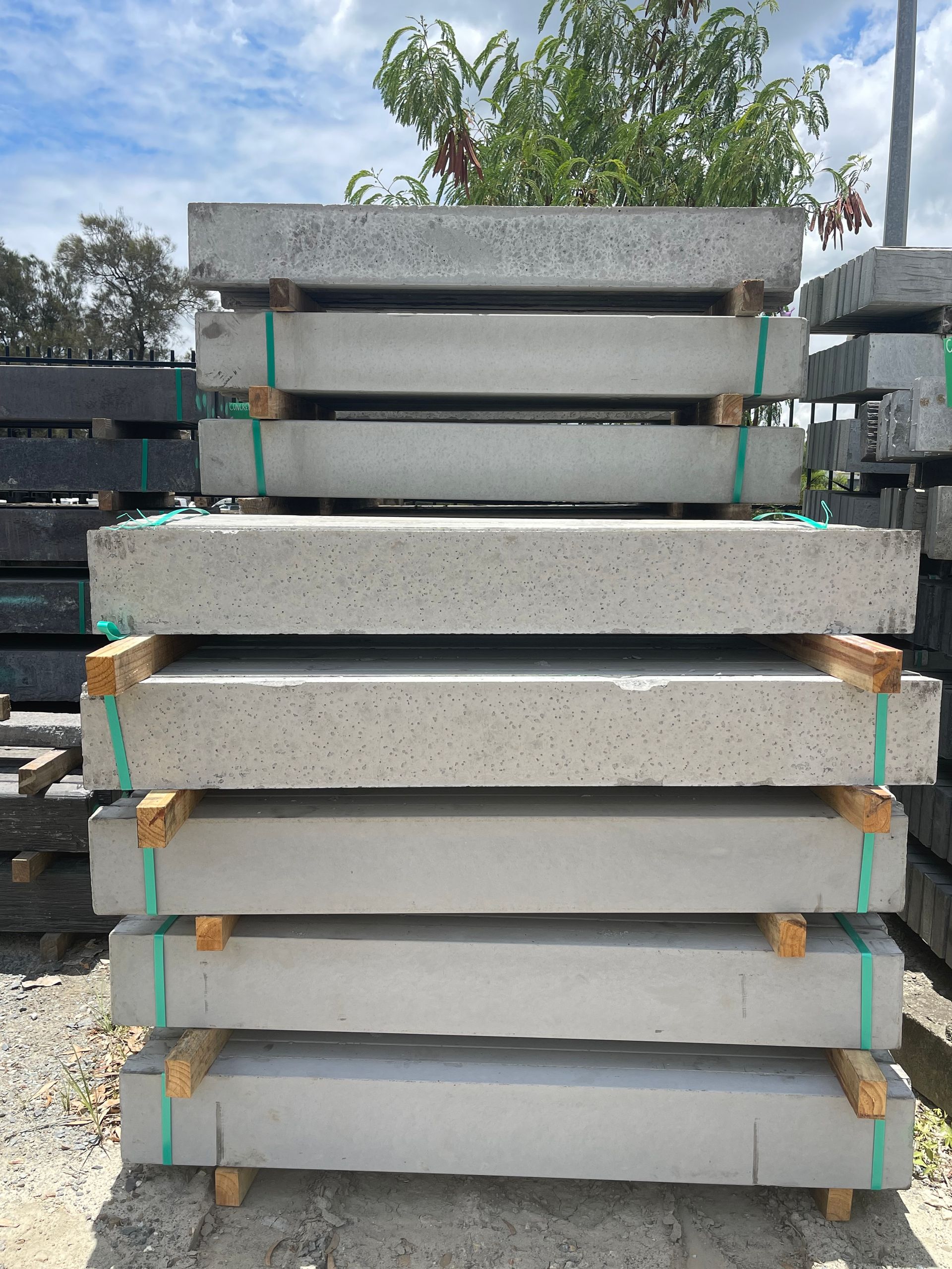 A pile of wooden boards stacked on top of each other.