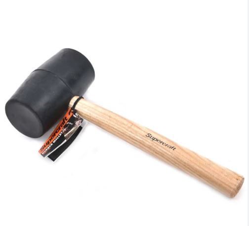 A black rubber hammer with a wooden handle