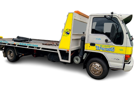 A white and yellow tow truck with the word tow truck on the side