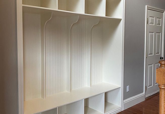 Custom built cabinets in a foyer.