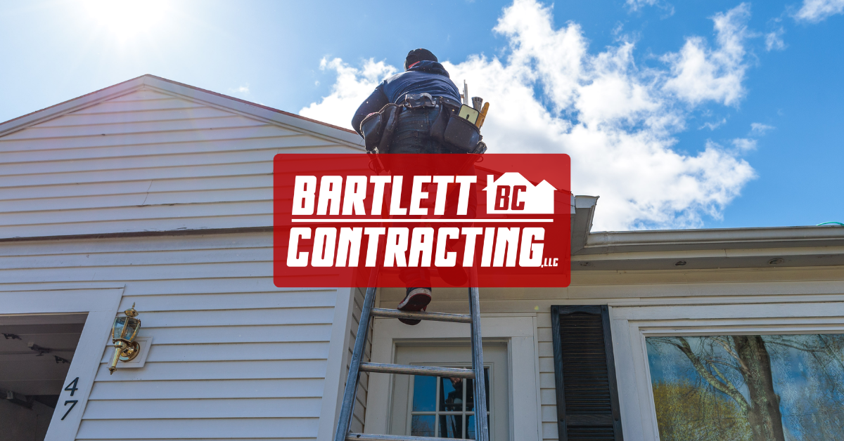 Bartlett LLC Contracting sign on a white house exterior under blue sky