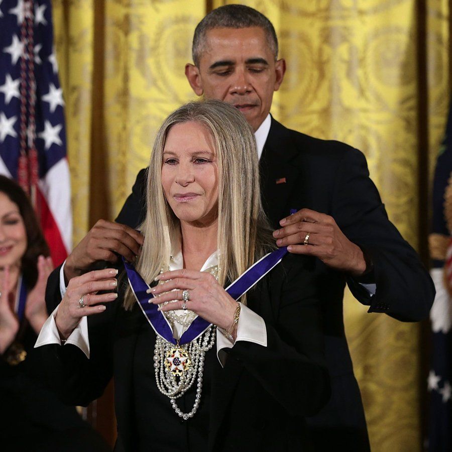 President Obama places the Medal of Freedom on Barbra Streisand, 2015