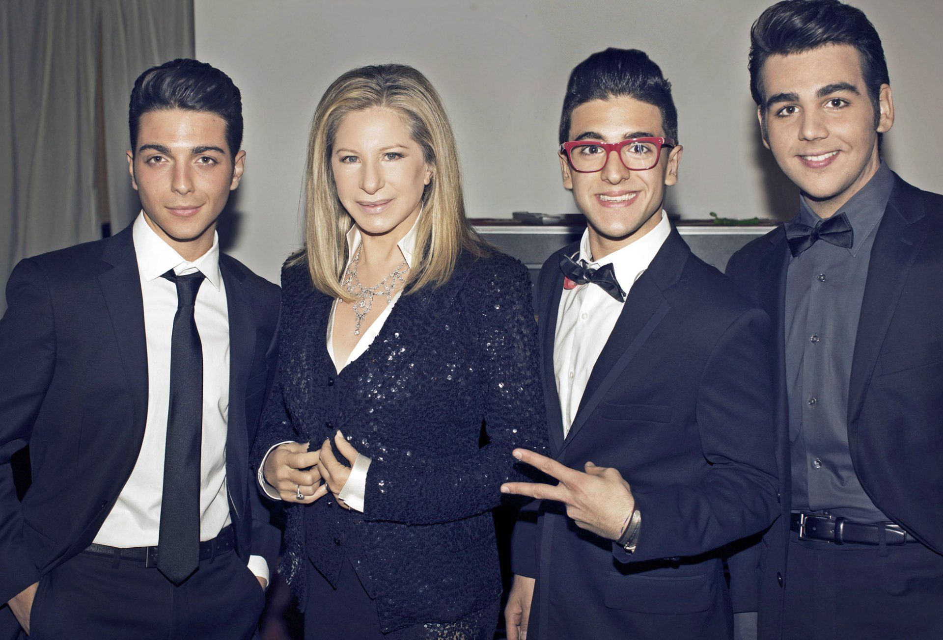 Streisand poses with the group Il Volo.  Photo by: Russell James
