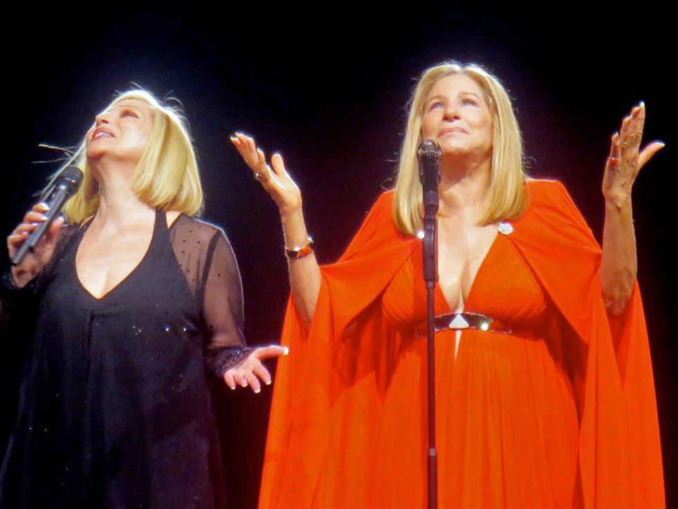 Roslyn Kind and Barbra Streisand acknowledge their mother before singing a duet together in San Jose, 2012.