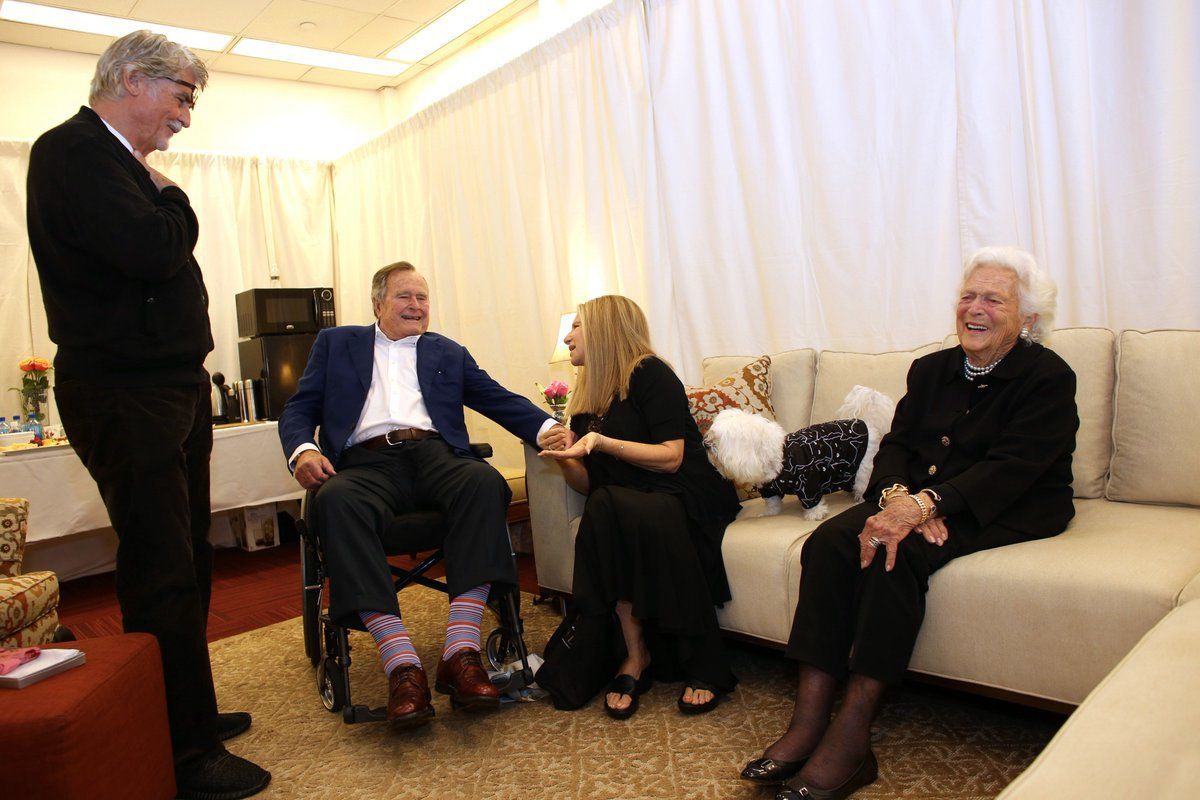 Barbra speaks with 41st President of the United States George Bush and Barbara Bush backstage in Houston. They were personally invited to the show by Barbra.
