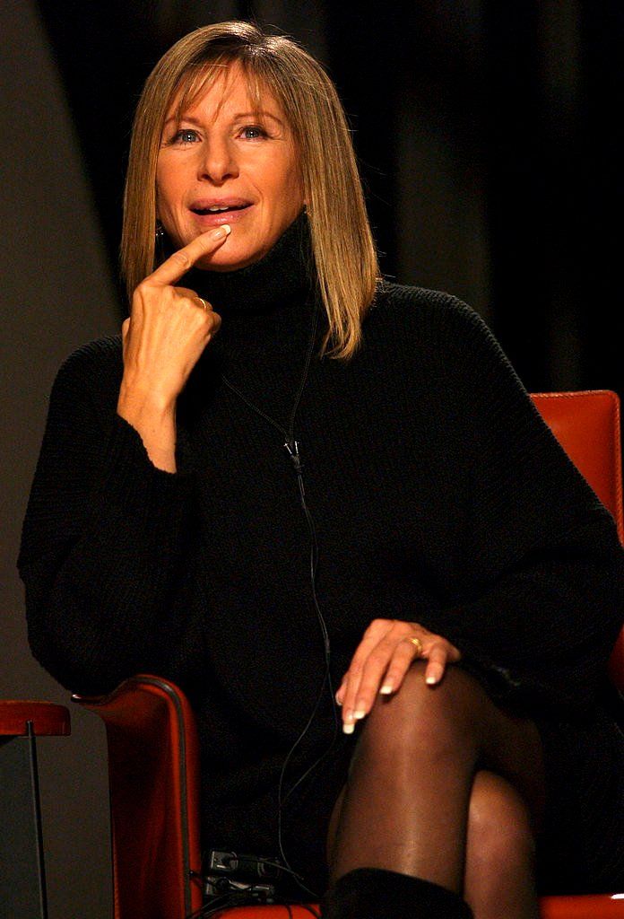 Streisand, dressed in black, answers one of James Lipton's questions.
