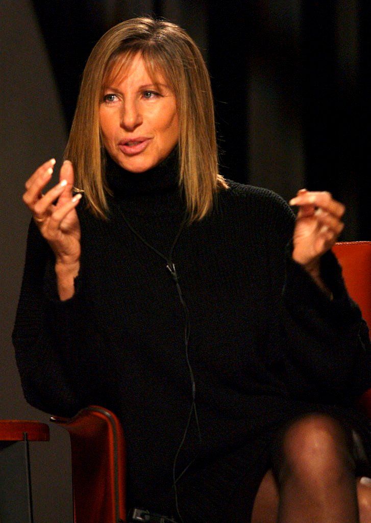 Streisand, dressed in black, answers one of James Lipton's questions.