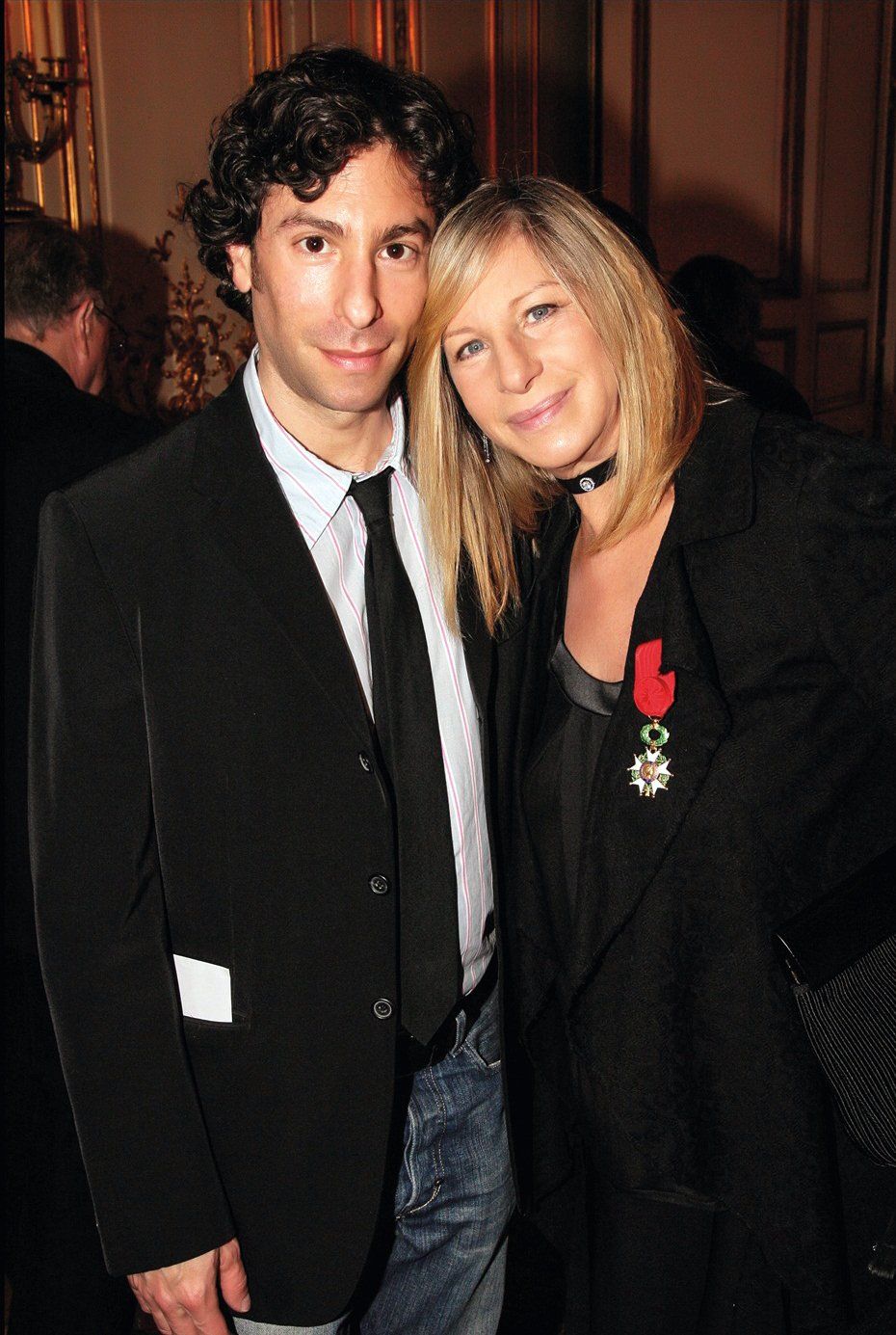 Jason Gould poses with his mother, Barbra Streisand, wearing the medal of the French Legion of Honor.