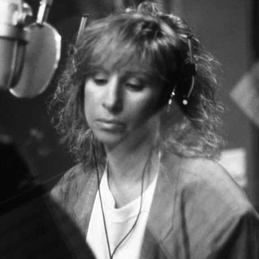 Barbra Streisand at the microphone.