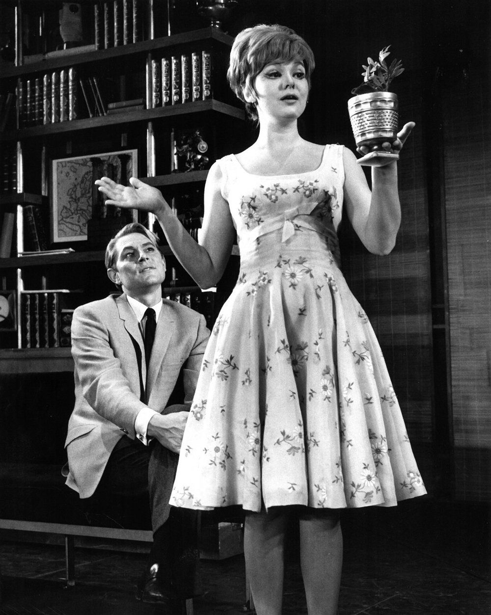Barbara Harris holding a potted flower in the Broadway show.