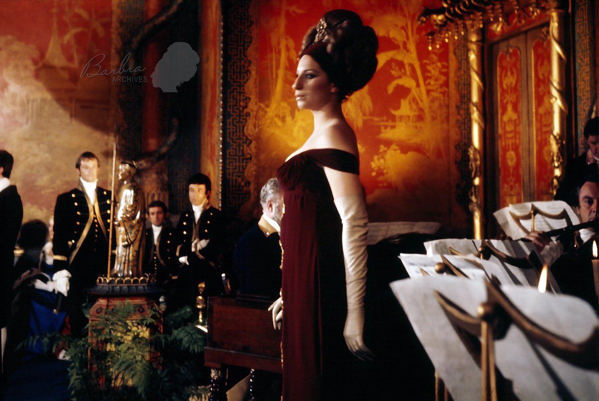Streisand wearing gorgeous burgundy gown in a cut scene from the movie.