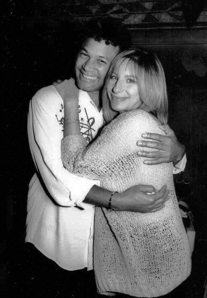 Narada Michael Walden hugs Barbra Streisand