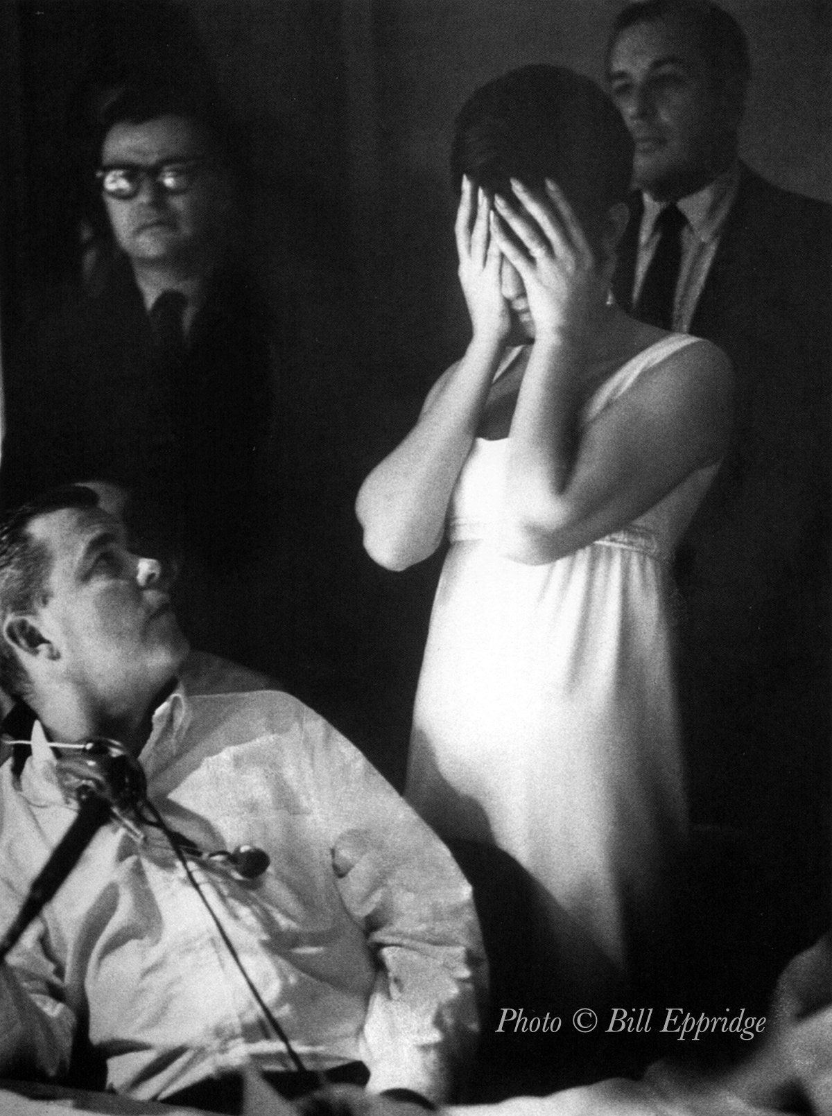 Streisand, in the video control booth, hides her eyes during video playback.  Dwight Hemion turns around, while Marty Erlichman (in glasses) watches.