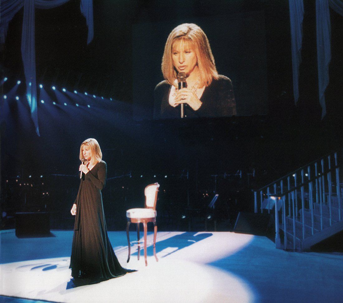 Streisand wearing the short-long Donna Karen dress.