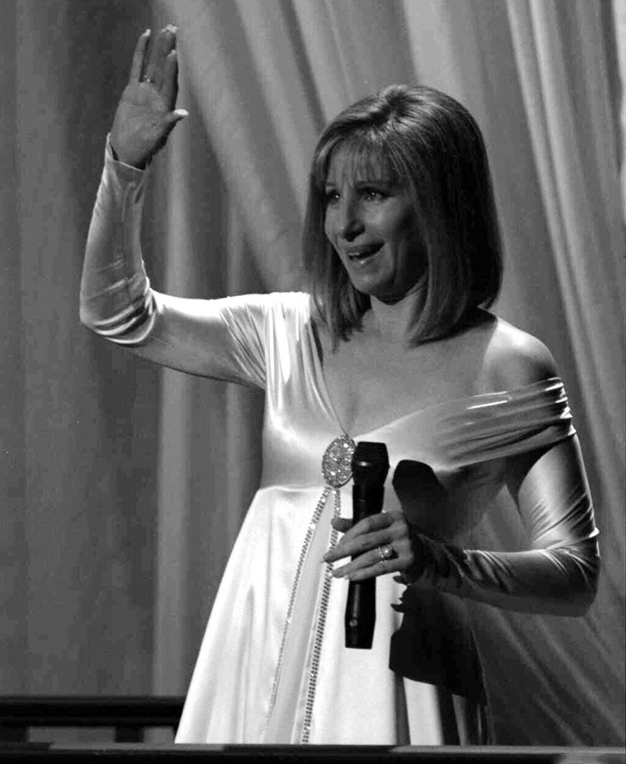 Streisand waves to her New York fans from the stage.