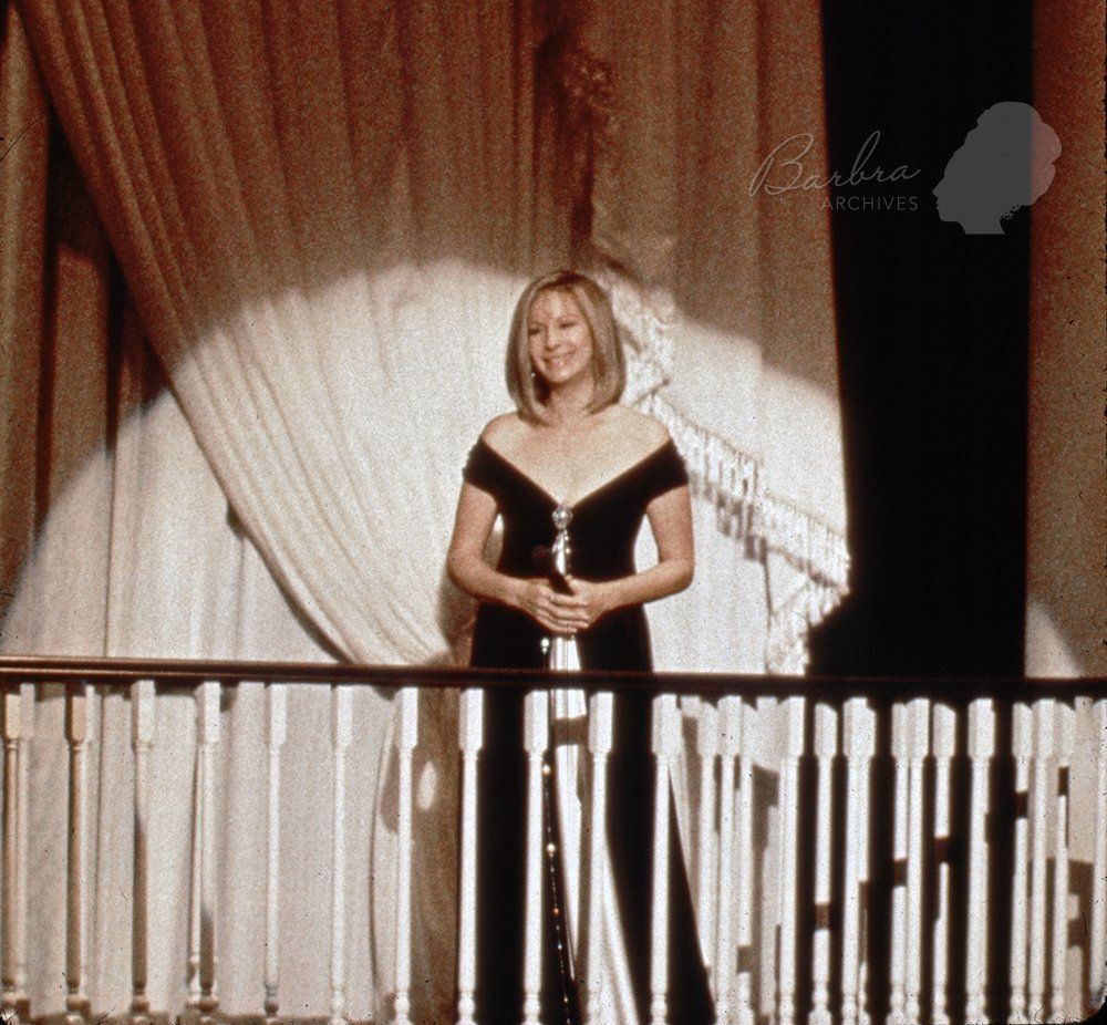 Barbra Streisand responding on stage to a tremendous standing ovation