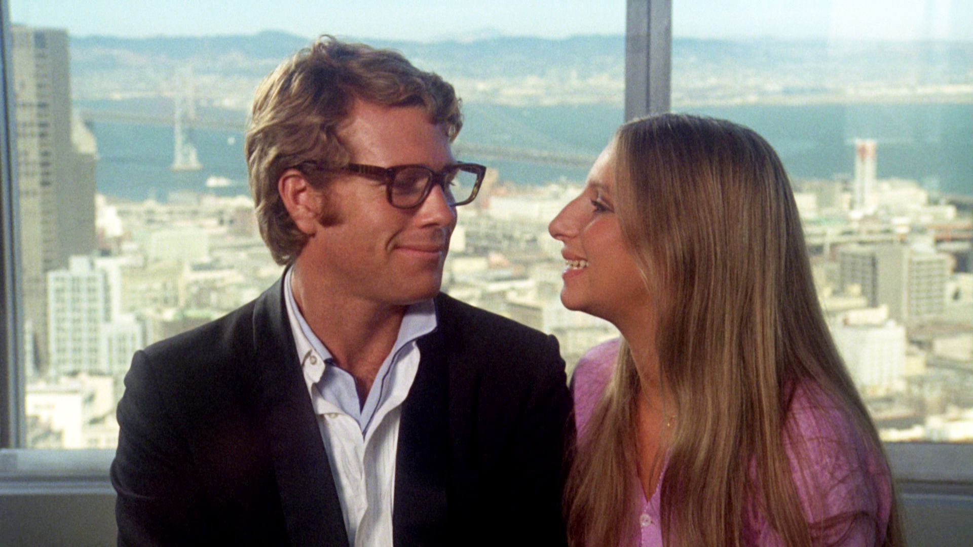 Ryan O'Neal and Barbra Streisand on screen in the film comedy What's Up Doc?