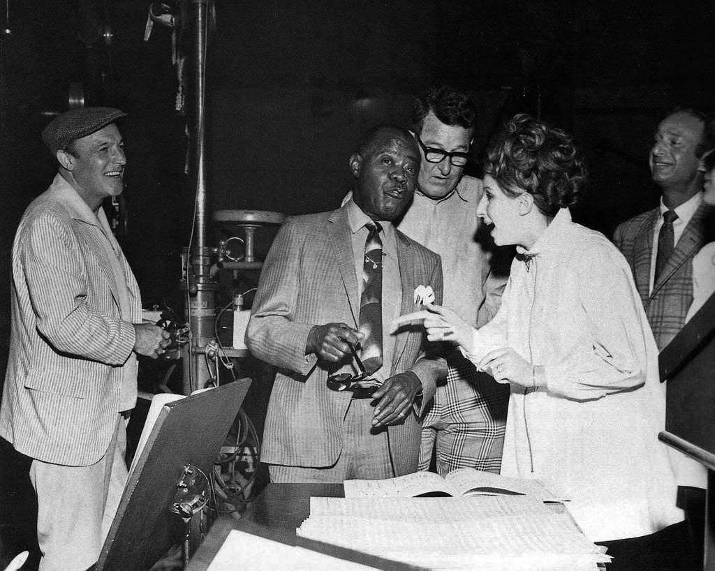 Gene Kelly, Louis Armstrong and Streisand in the recording studio.