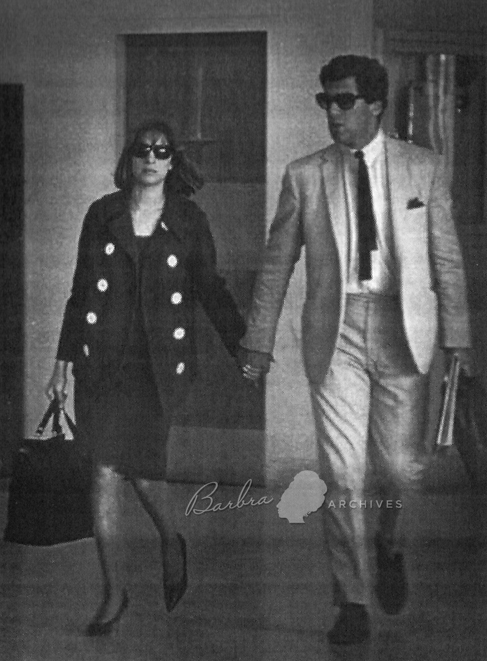 Barbra Streisand and Elliott Gould snapped by a photographer at the Miami airport